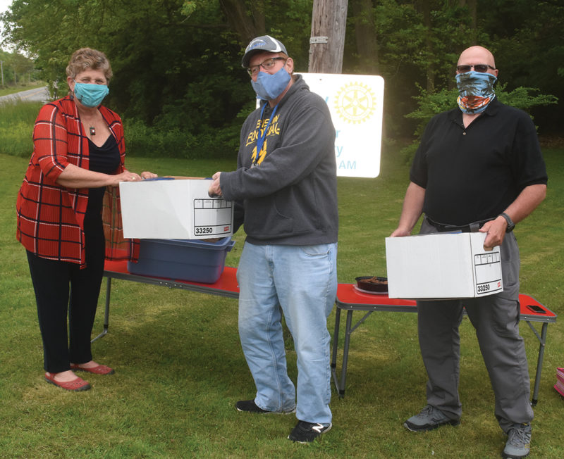 Leslie Wood giving the masks to the superintendents of the schools.